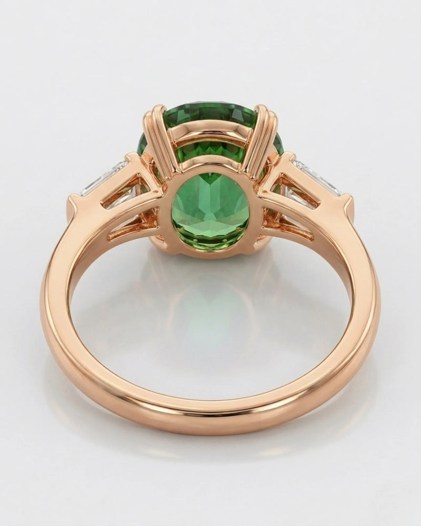 Green tourmaline engagement ring with emerald-cut diamond accents in 18K rose gold | SARATTI