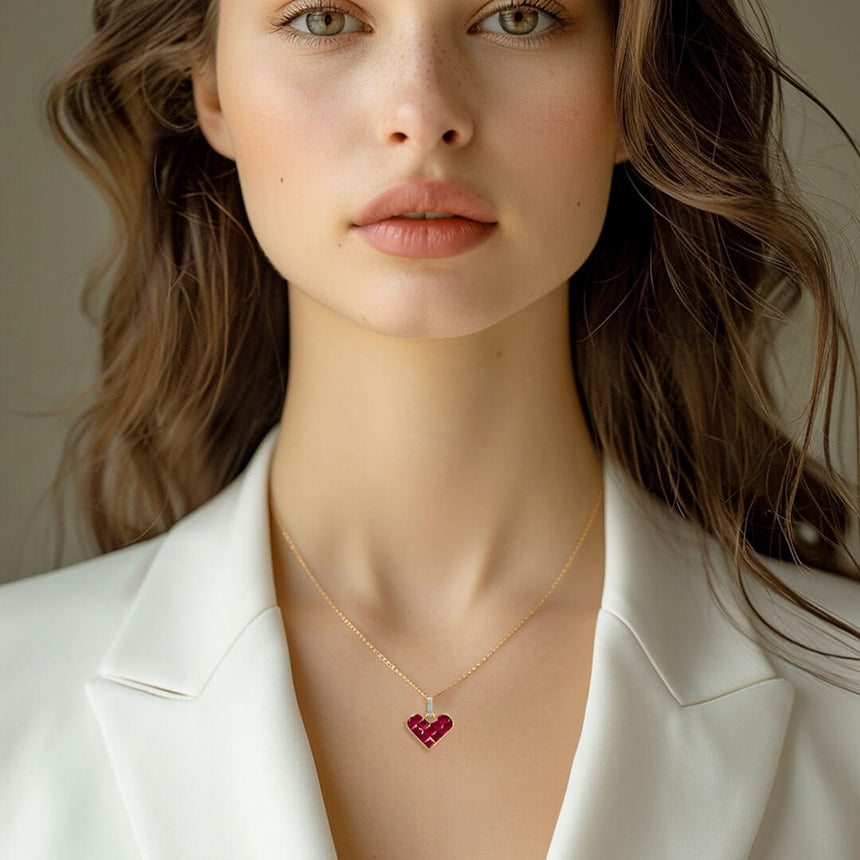 Model wears the dainty Alma Rosa Ruby Heart Necklace | Saratti Fine Jewelry
