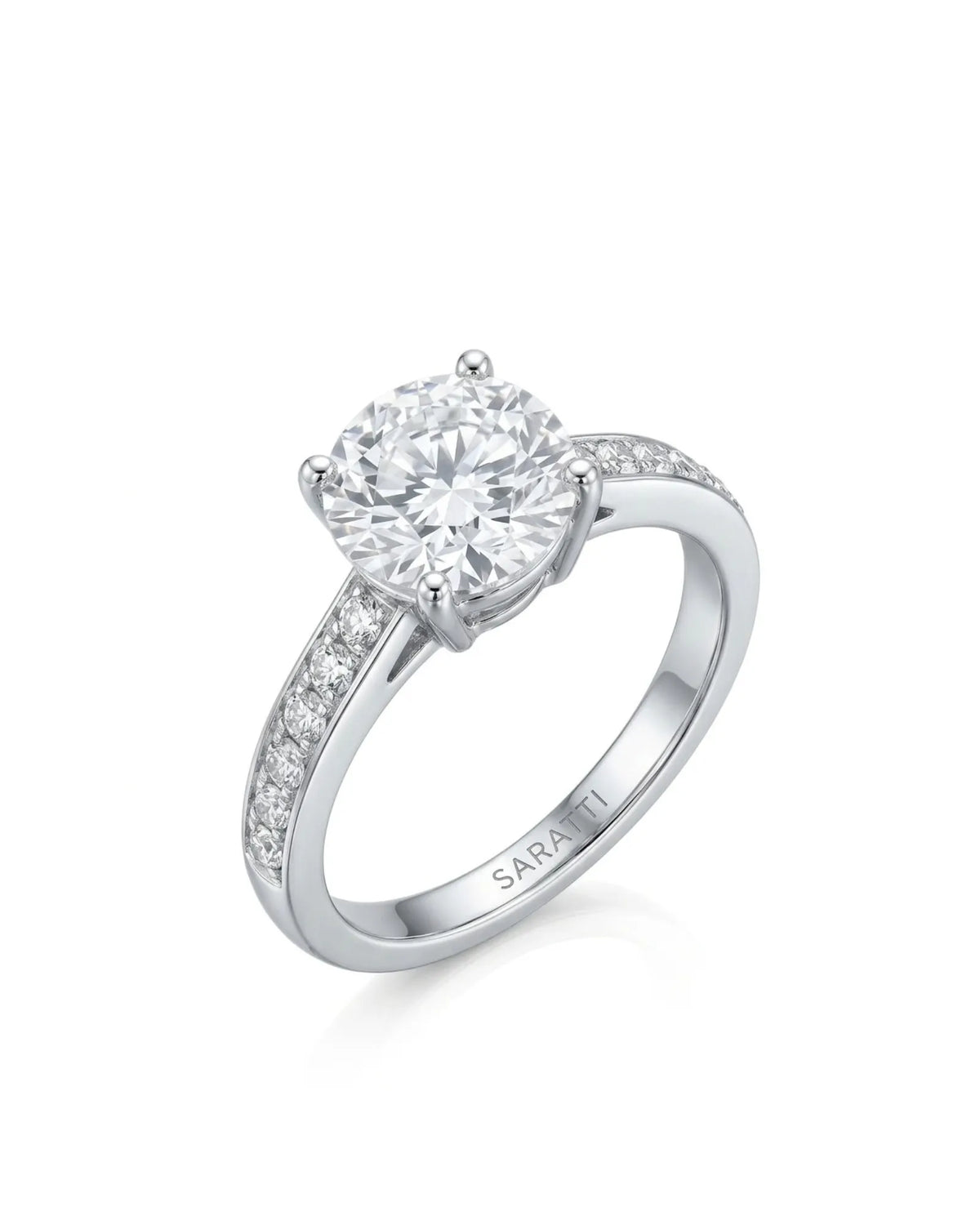 Layla round centre stone engagement ring 45-degree view with diamond-set shoulders in 18K white gold | SARATTI
