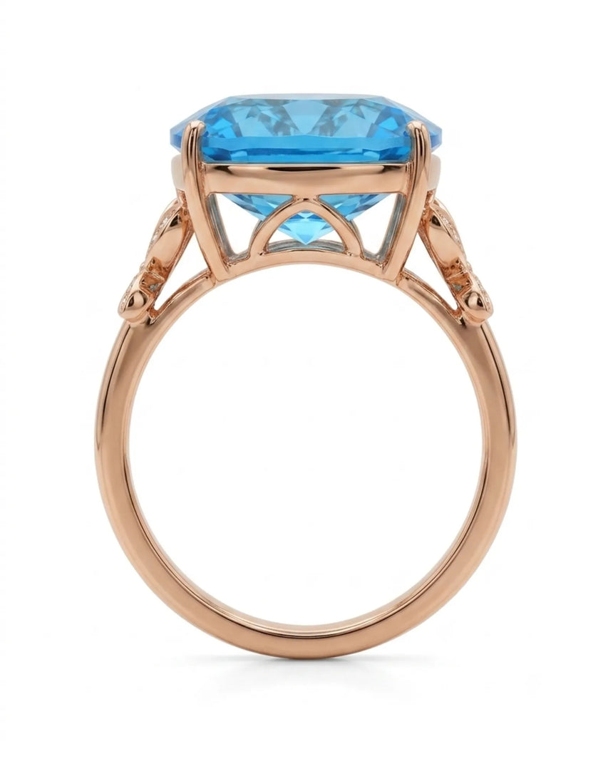 Luxury Swiss Blue topaz statement ring with sculpted diamond shoulders in 18K rose gold | SARATTI
