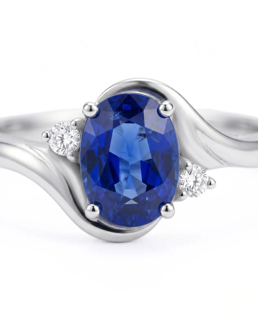 Luxury blue sapphire diamond ring with refined curved design in platinum | SARATTI