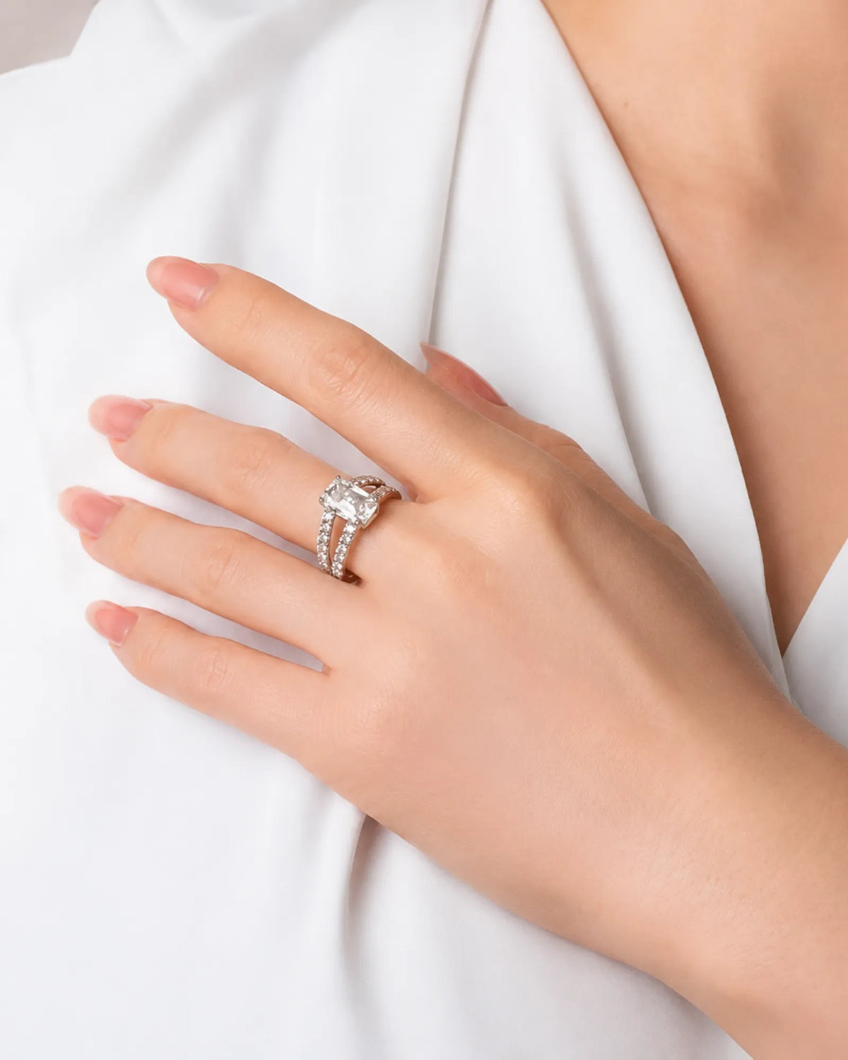Luxury emerald-cut moissanite ring with pavé white gold split-shank design | SARATTI