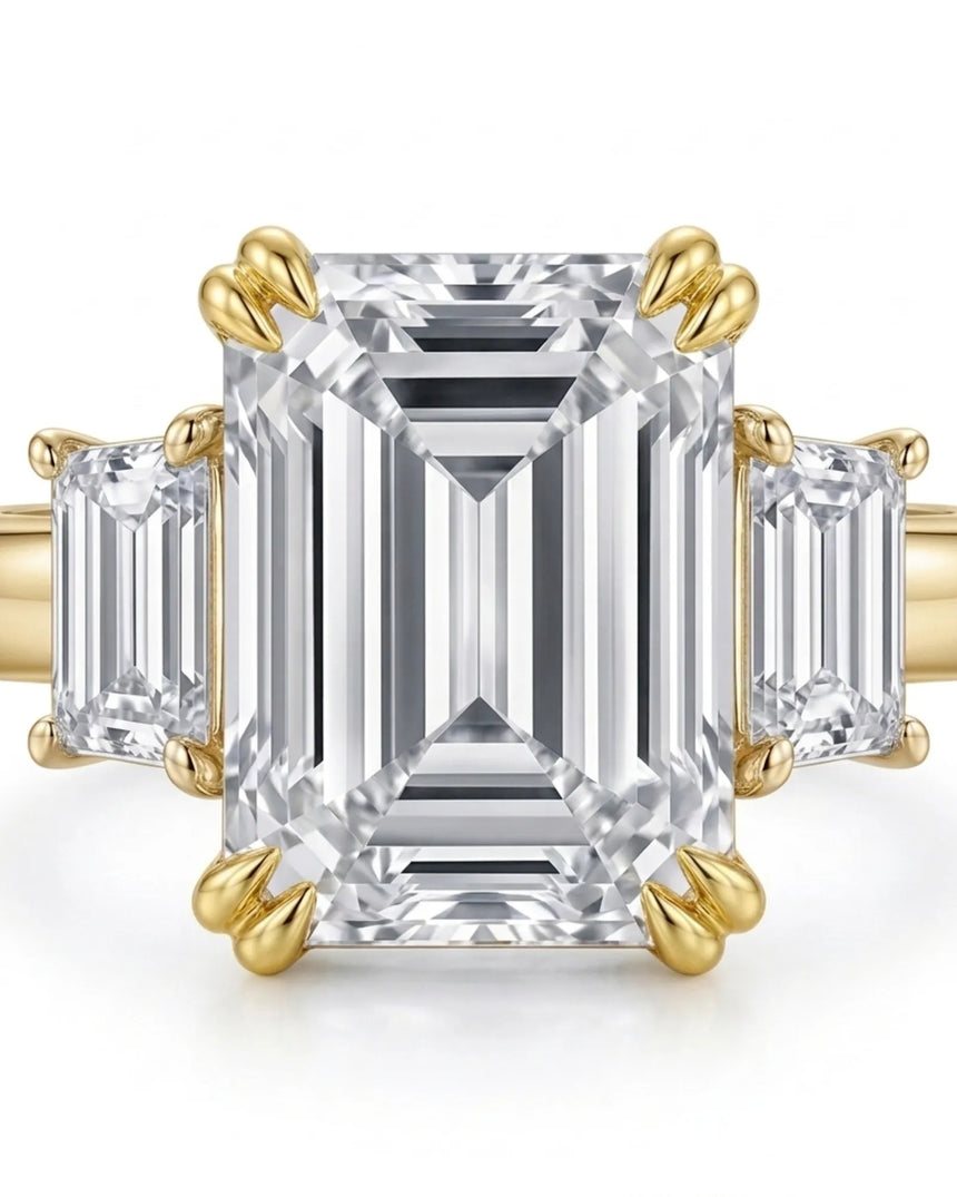 Luxury emerald cut moissanite ring with side stones and rich yellow gold finish | SARATTI