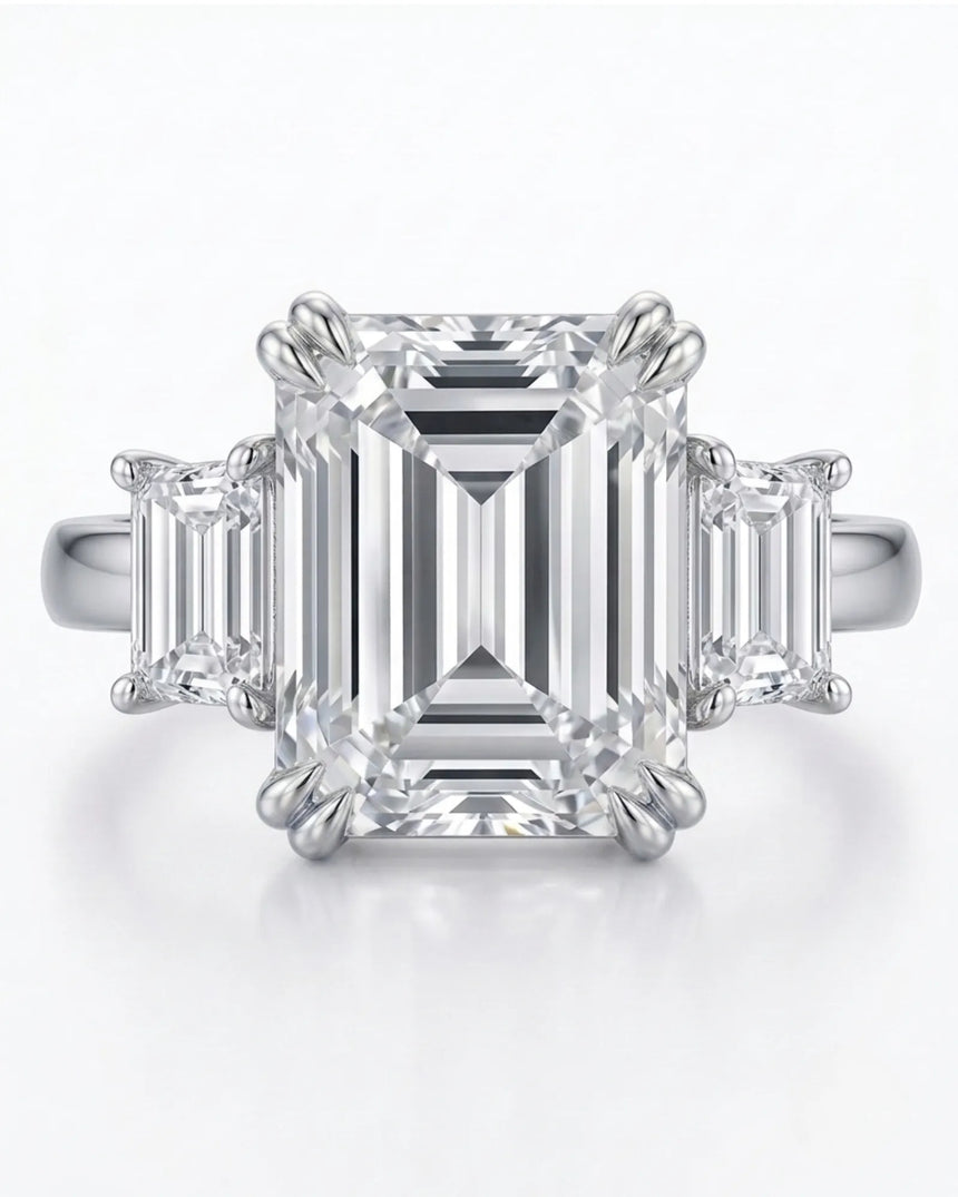 Luxury emerald cut moissanite ring with side stones and timeless platinum finish -- SARATTI