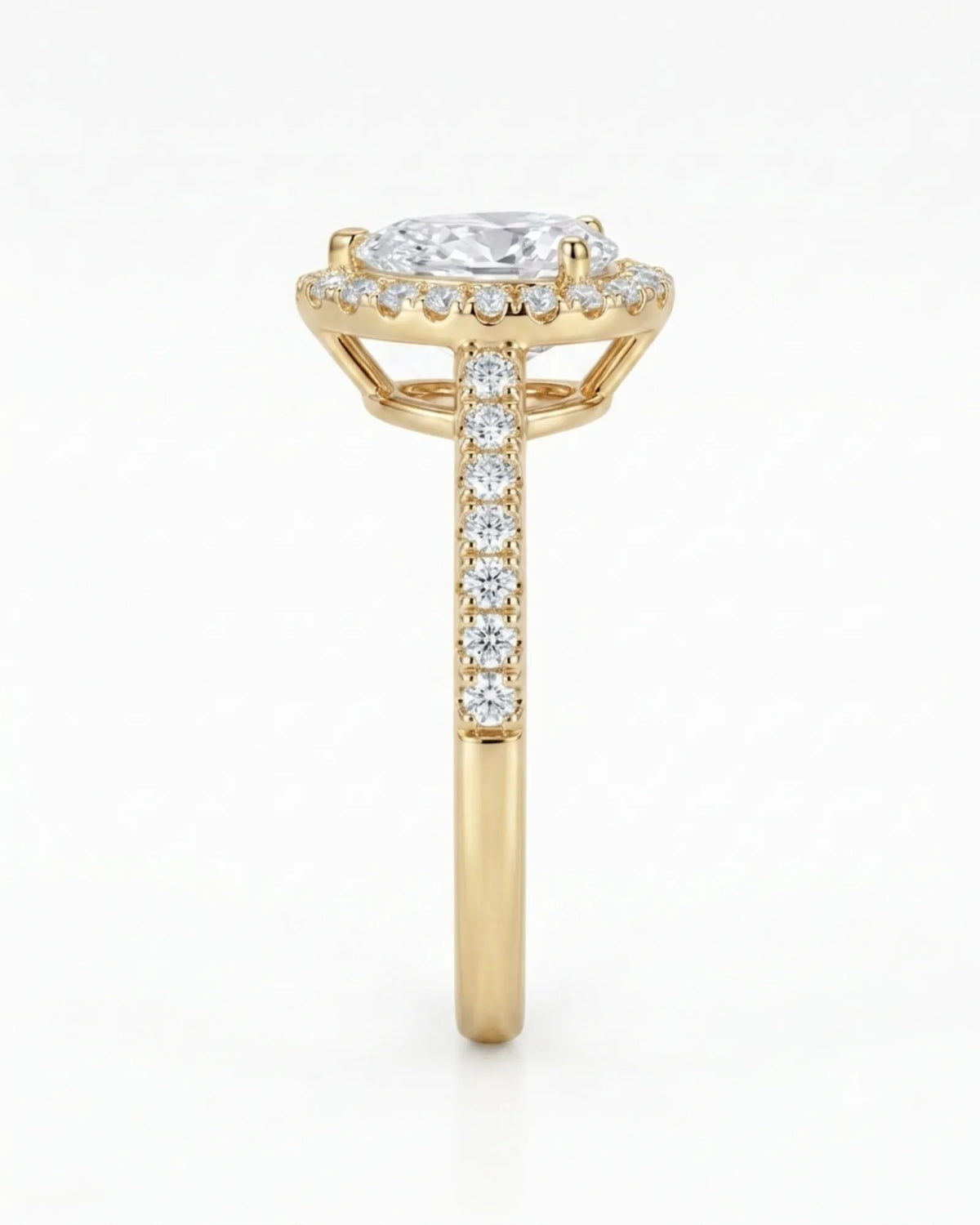 Luxury moissanite engagement ring featuring a pear center and luminous halo in yellow gold - SARATTI