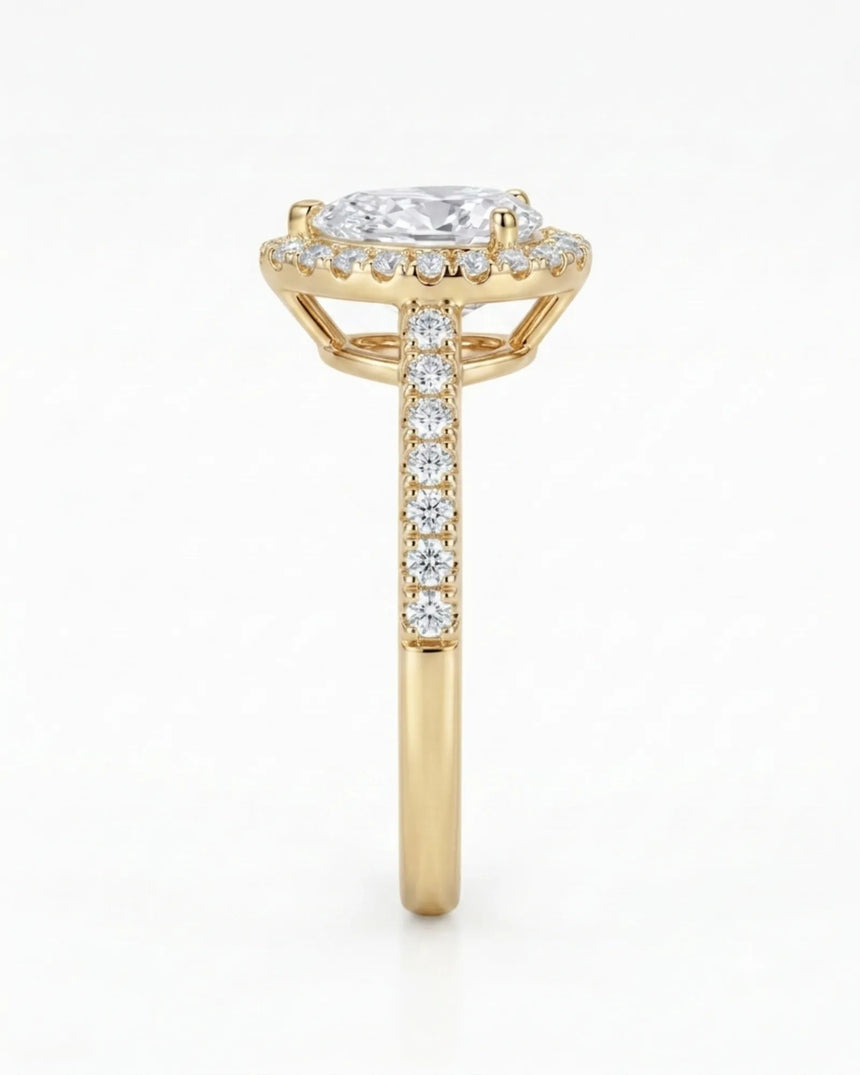 Luxury moissanite engagement ring featuring a pear center and luminous halo in yellow gold - SARATTI