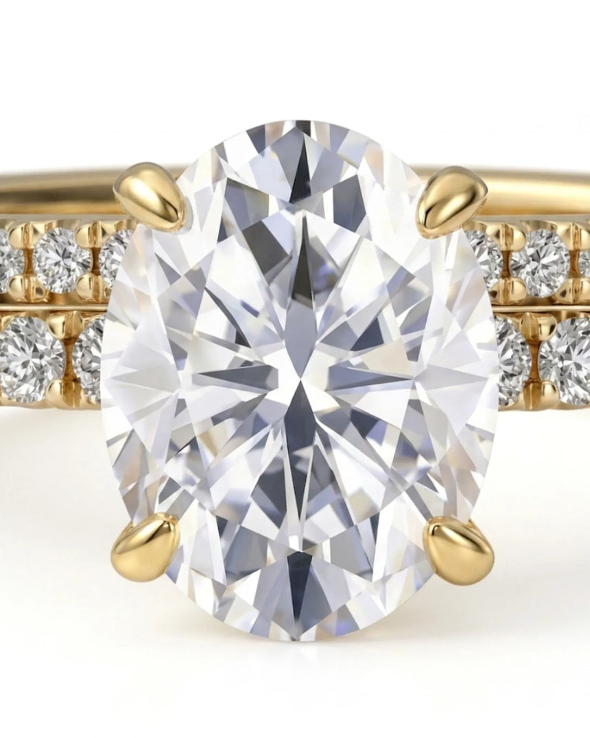 Luxury oval moissanite bridal set with matching pavé bands and rich 18K yellow gold craftsmanship | SARATTI