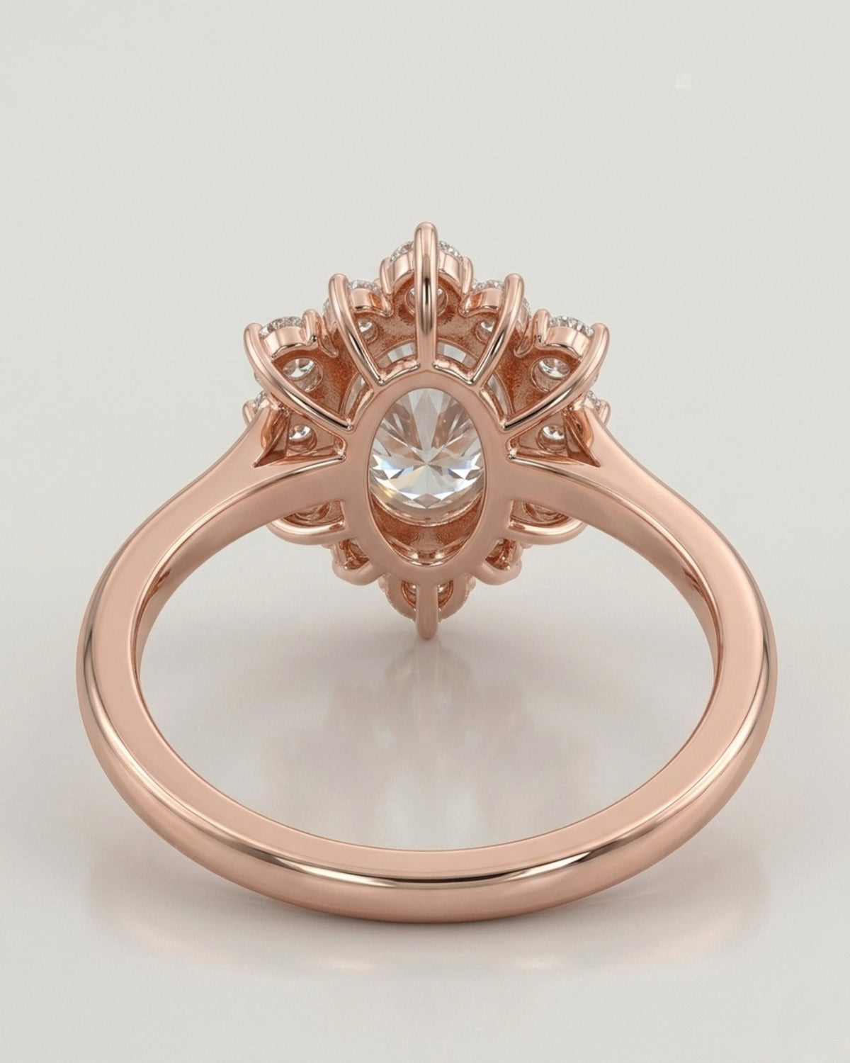 Luxury oval moissanite ring with floral halo and warm rose gold setting | SARATTI