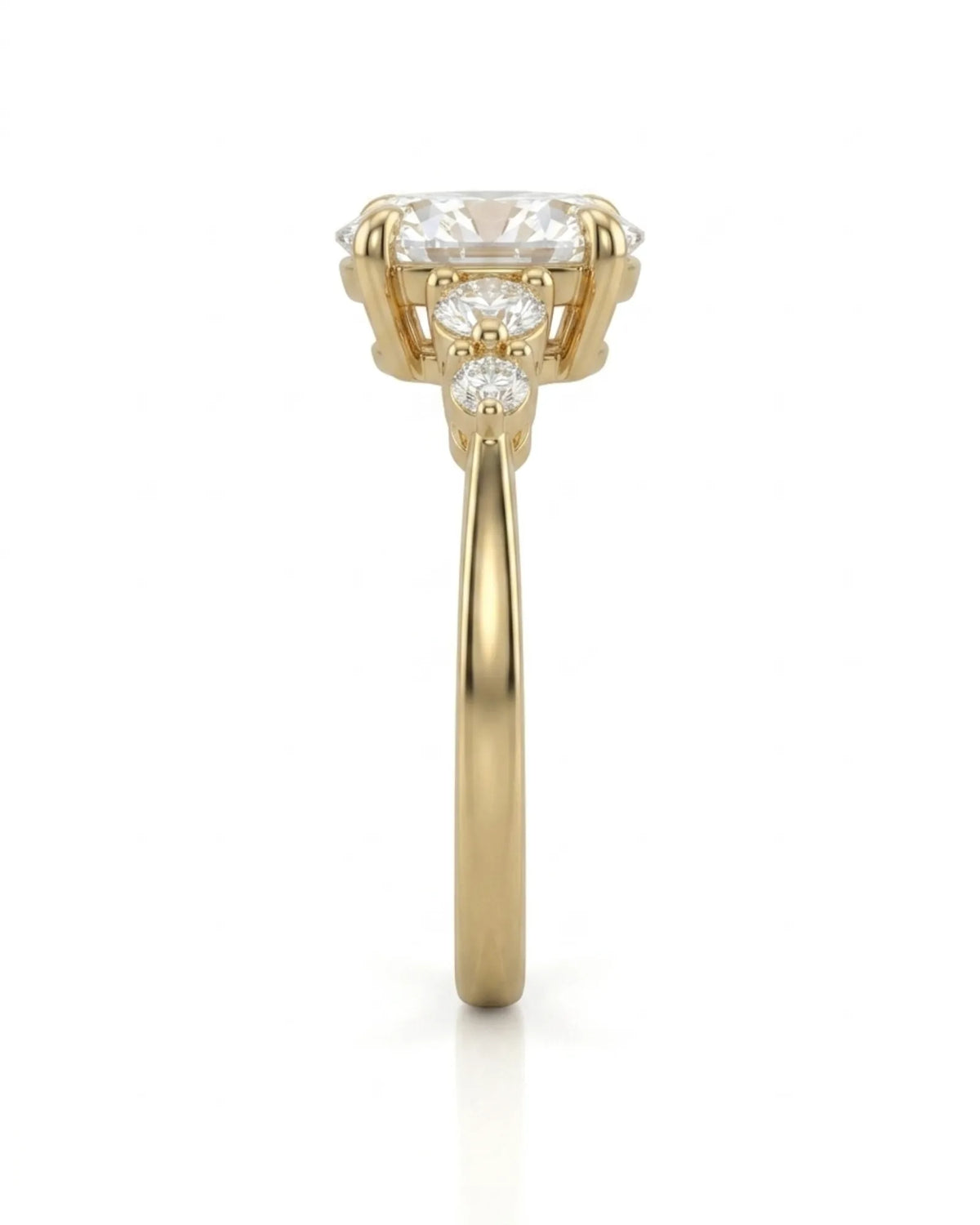 Luxury oval moissanite ring with graduated side stones and rich yellow gold setting | SARATTI