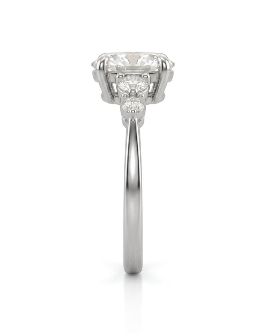 Luxury oval moissanite ring with graduated side stones and white gold setting - SARATTI