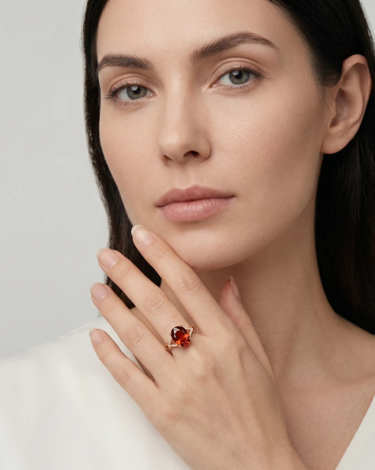 Luxury oval orange garnet ring with diamond accents in 18K rose gold | SARATTI