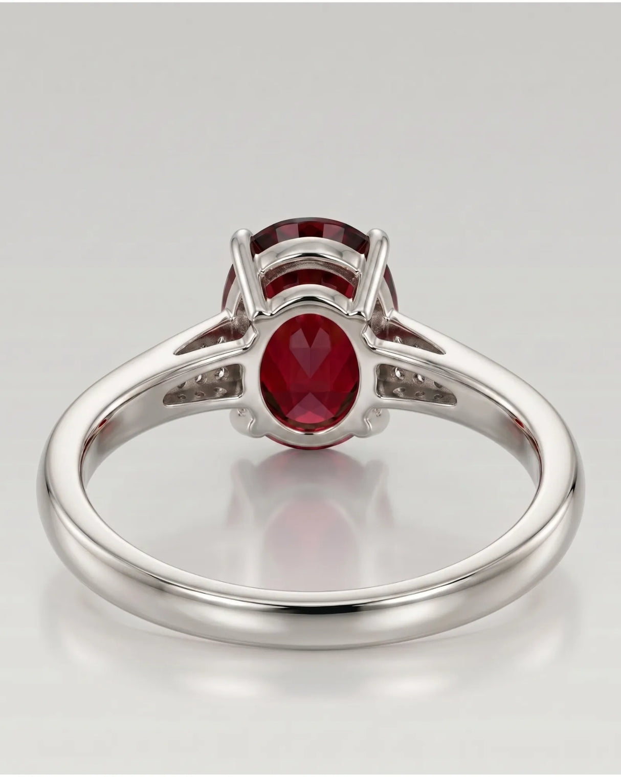 Luxury oval red garnet ring with diamond accents in 18K white gold | SARATTI