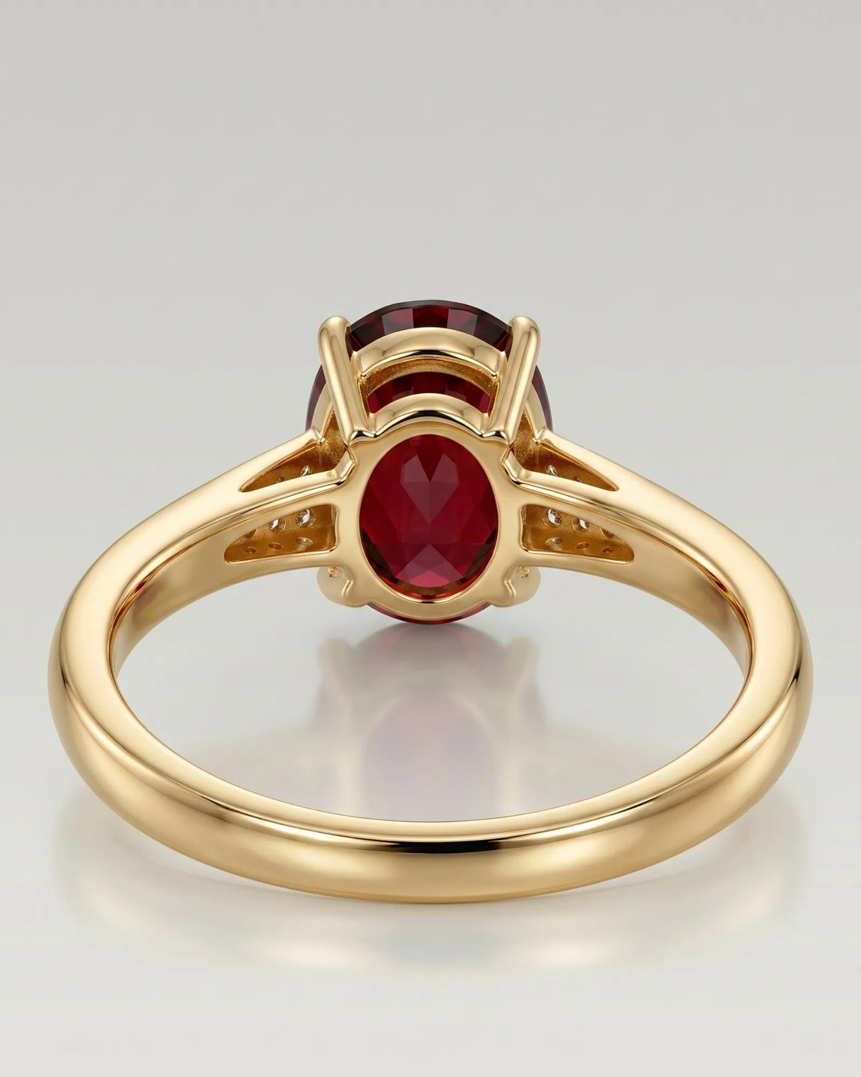 Luxury oval red garnet ring with diamond accents in 18K yellow gold - SARATTI