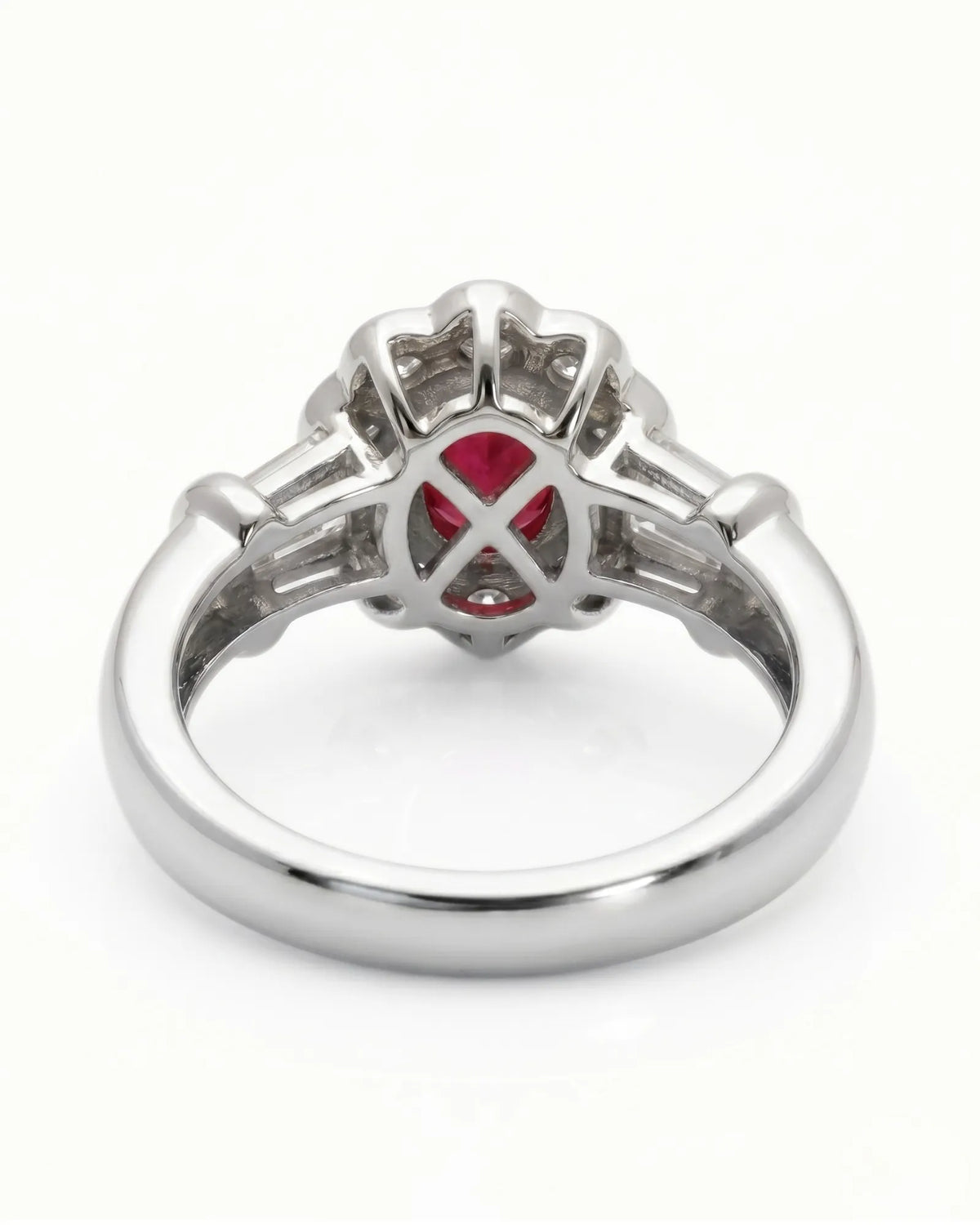 Luxury oval ruby halo ring with diamond accents in platinum craftsmanship | SARATTI