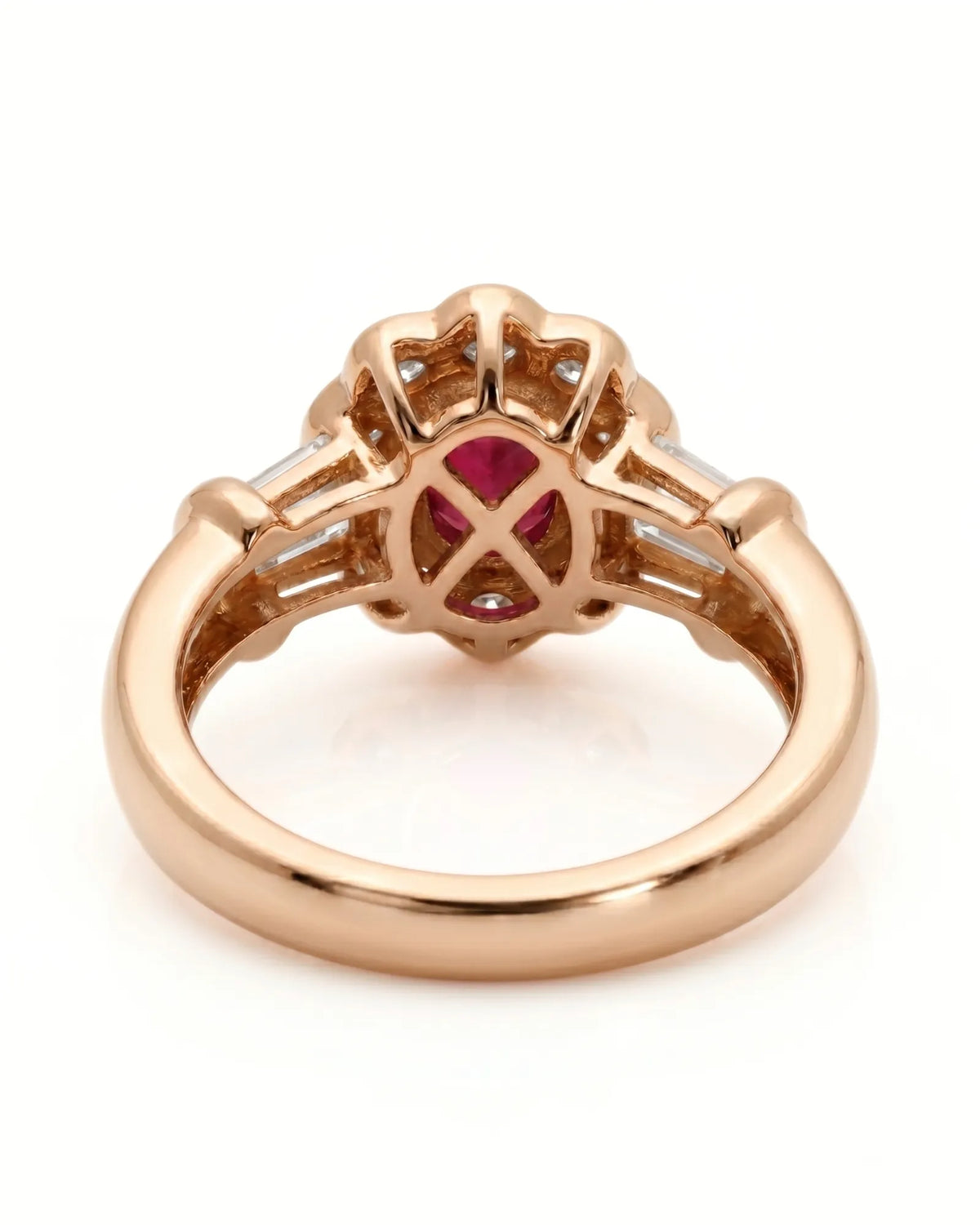 Luxury oval ruby halo ring with diamond accents in refined rose gold | SARATTI