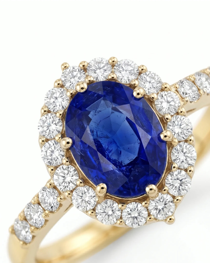 Luxury oval sapphire diamond ring with brilliant halo in 18K yellow gold | SARATTI