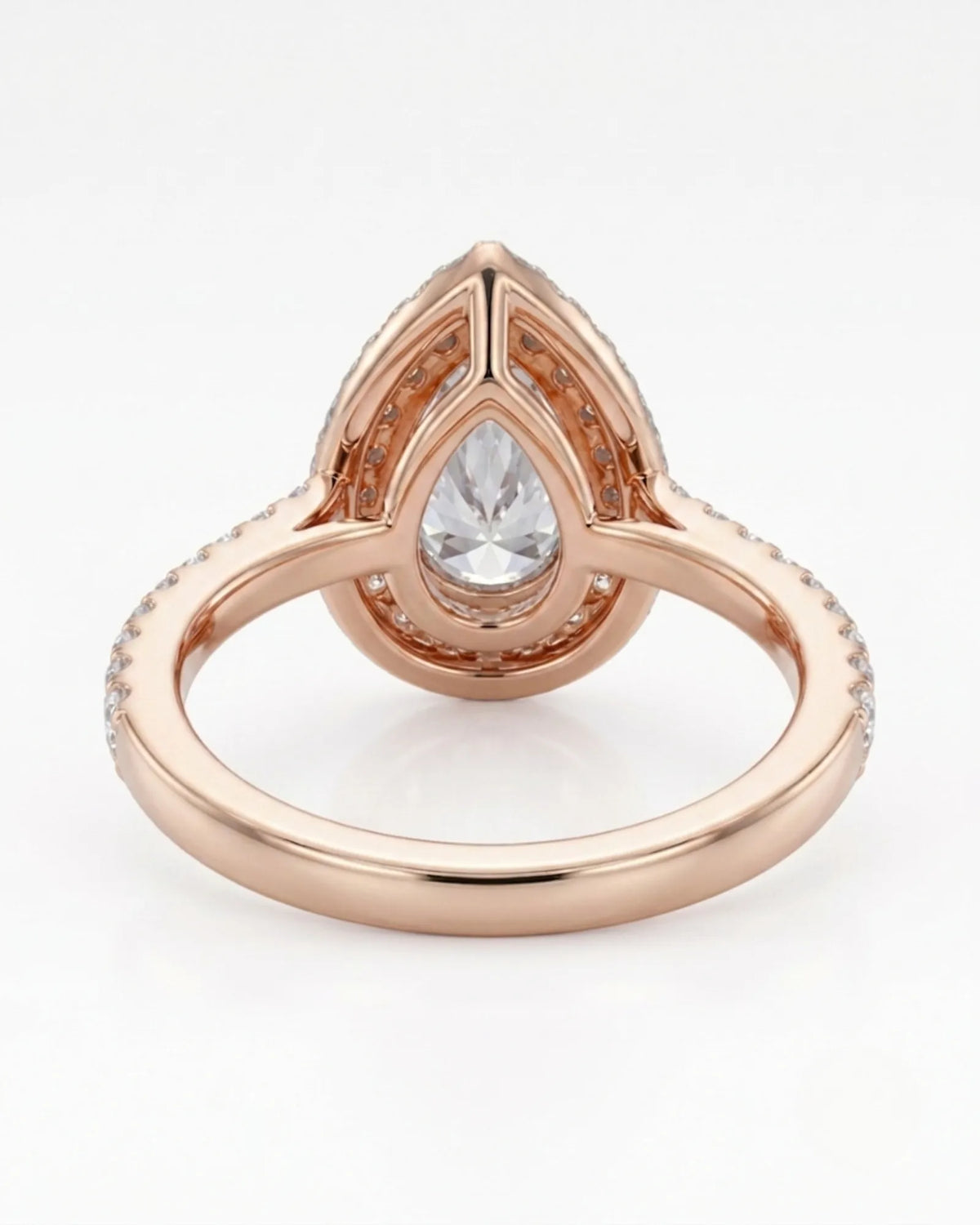 Luxury pear halo moissanite ring combining brilliant accents with warm rose gold elegance - SARATTI