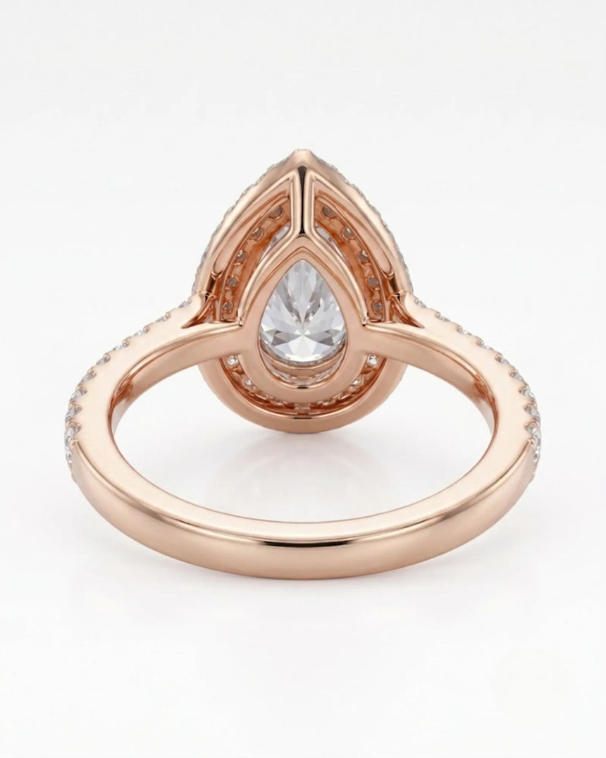 Luxury pear halo moissanite ring combining brilliant accents with warm rose gold elegance - SARATTI