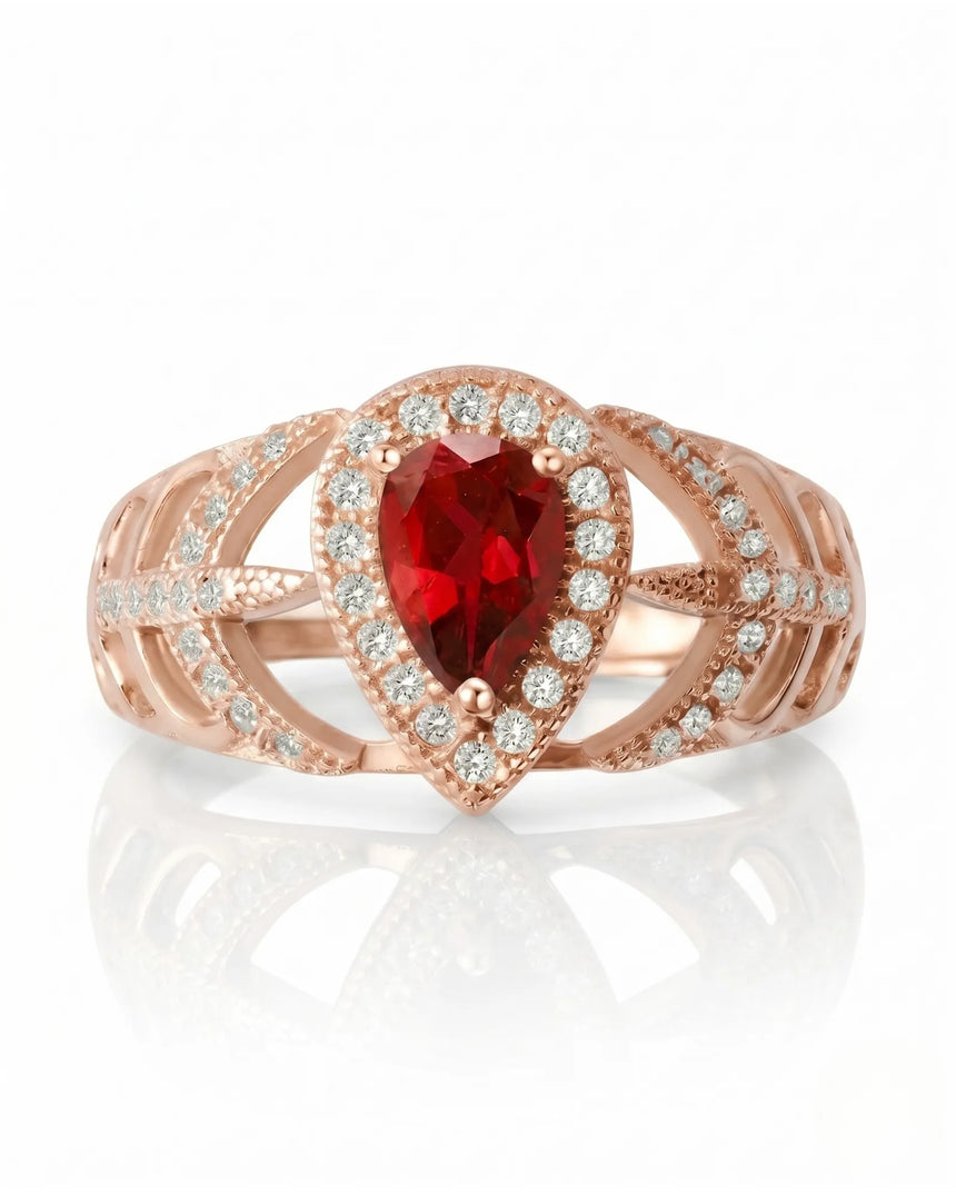 Luxury pear shaped ruby ring with diamonds in polished 18K rose gold | SARATTI