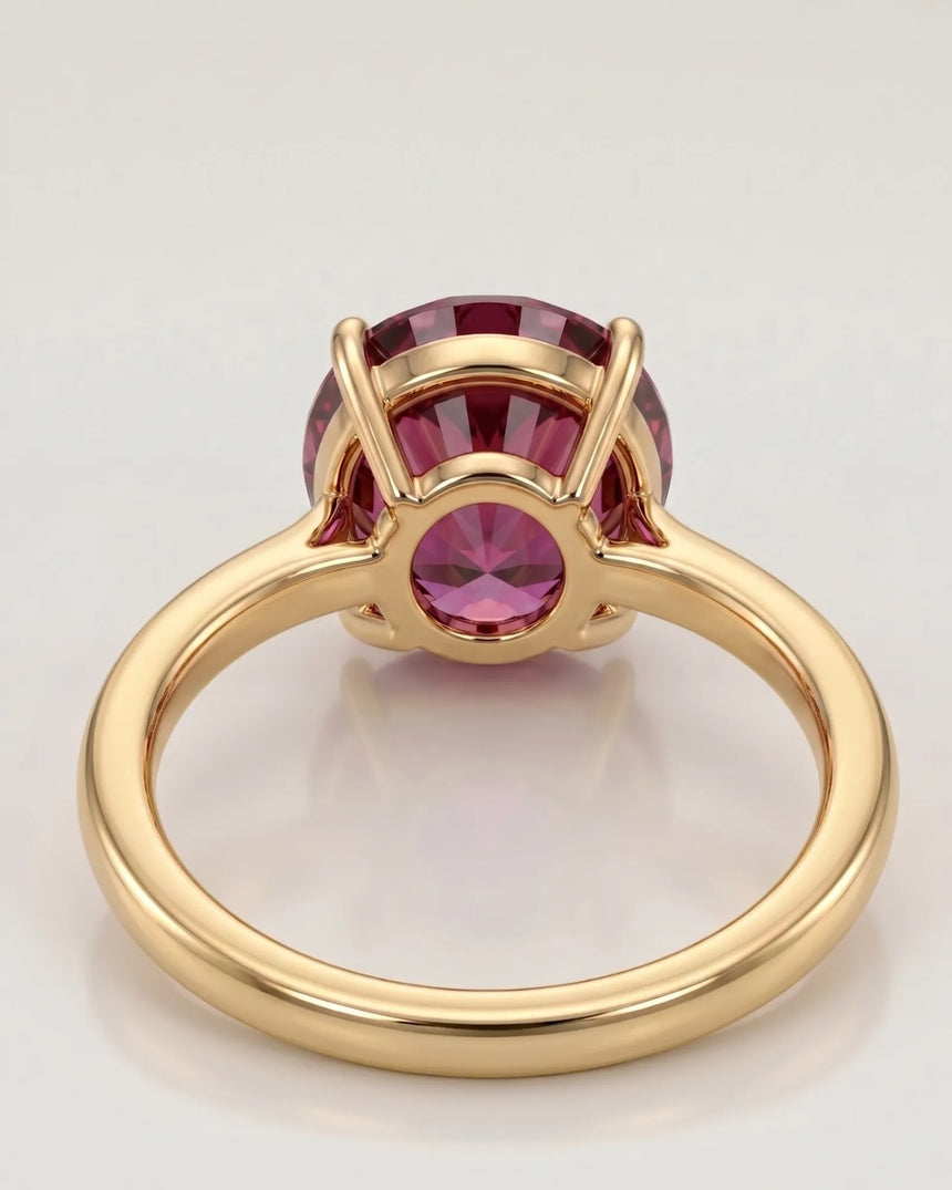 Luxury pink tourmaline ring with oval center stone in 18K yellow gold | SARATTI