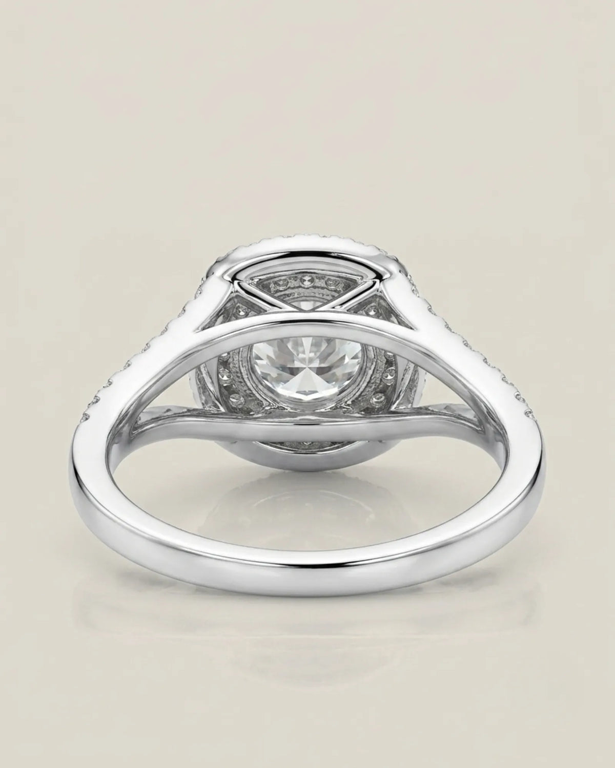 Luxury platinum halo bridal set with round moissanite center and seamless curved wedding band | SARATTI.