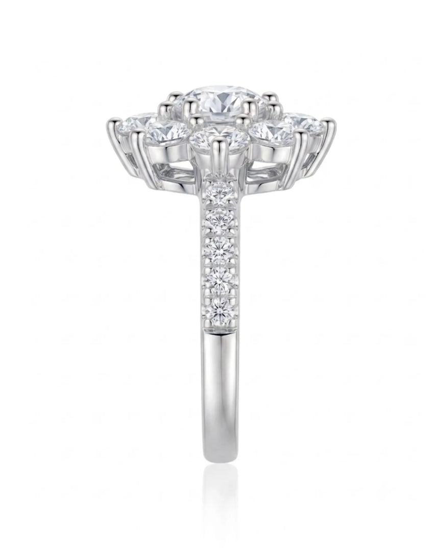 Luxury round moissanite ring with flower-inspired cluster and refined 18K white gold craftsmanship | SARATTI