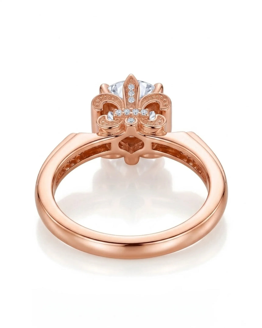 Luxury round moissanite ring with pavé accents and sculptural fleur-de-lis gallery crafted in 18K rose gold | SARATTI