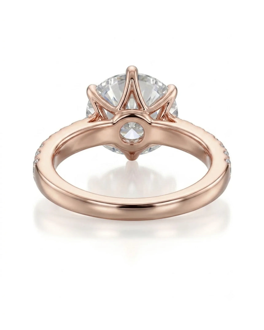 Luxury round moissanite ring with pavé shoulders and warm rose gold setting - SARATTI