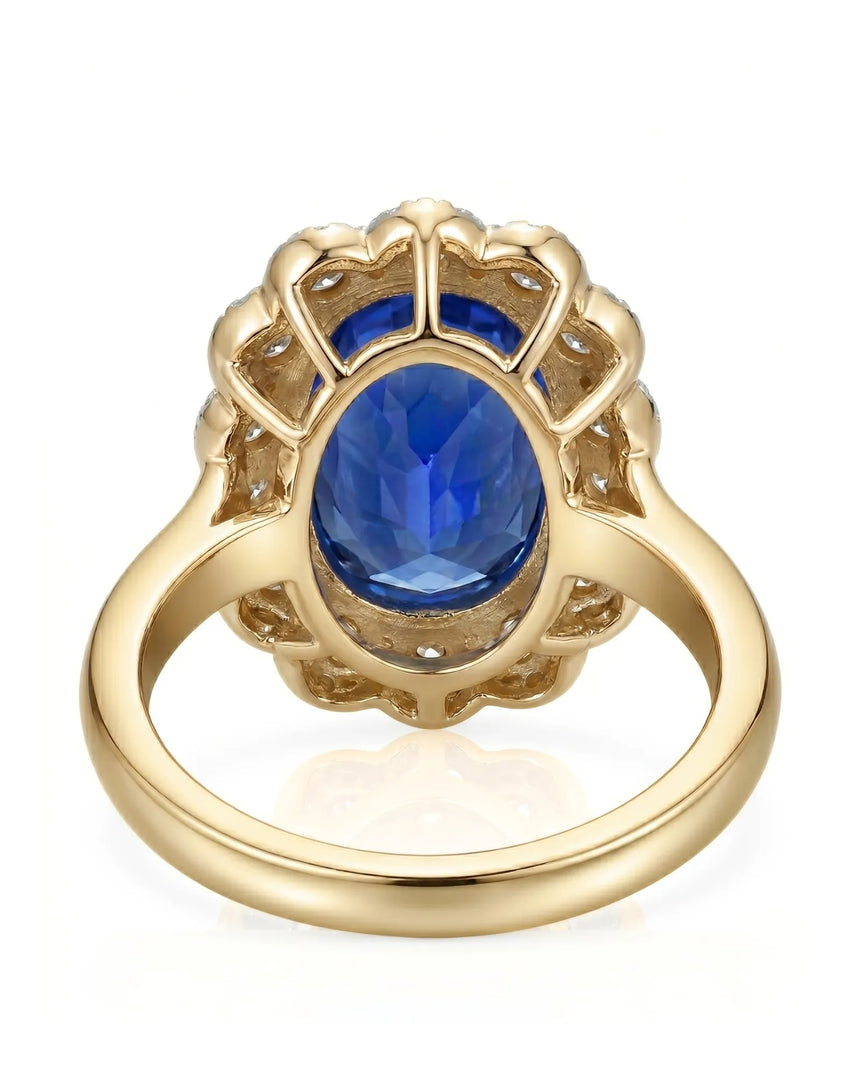 Luxury royal blue sapphire cocktail ring with diamond halo in 18K yellow gold | SARATTI
