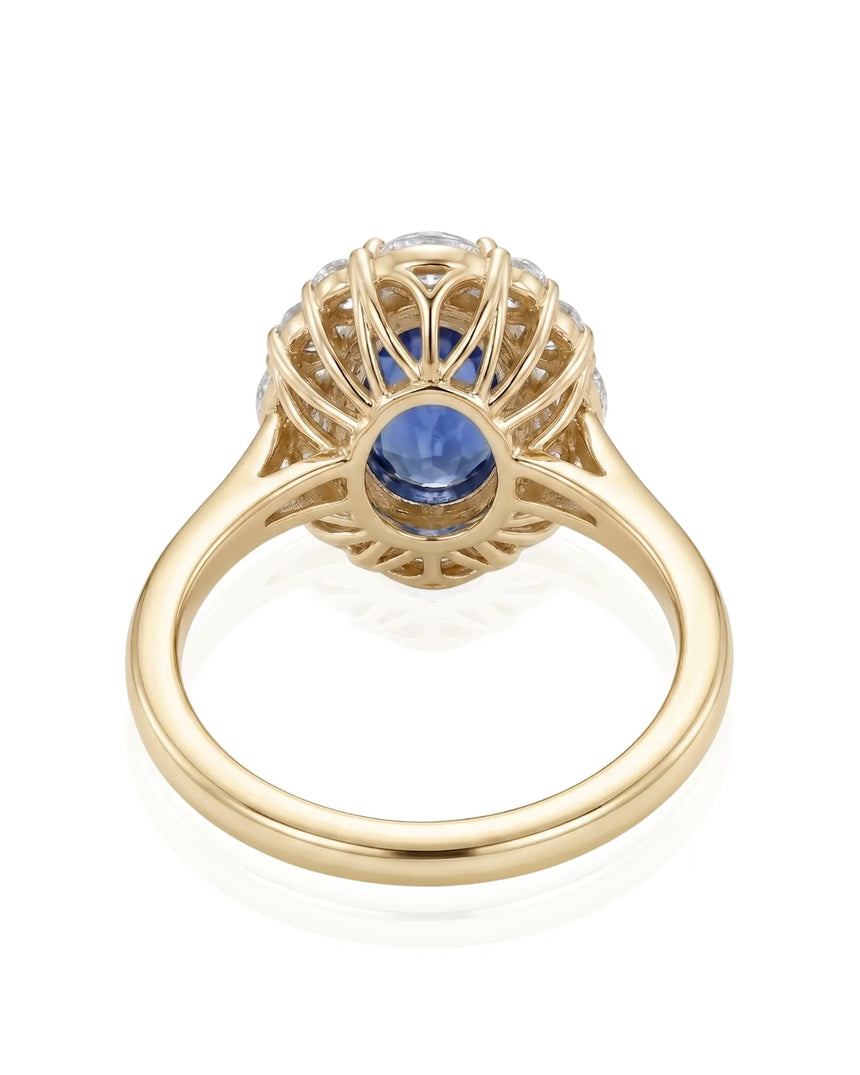 Luxury royal blue sapphire diamond ring with warm gold halo design in 18K yellow gold - SARATTI