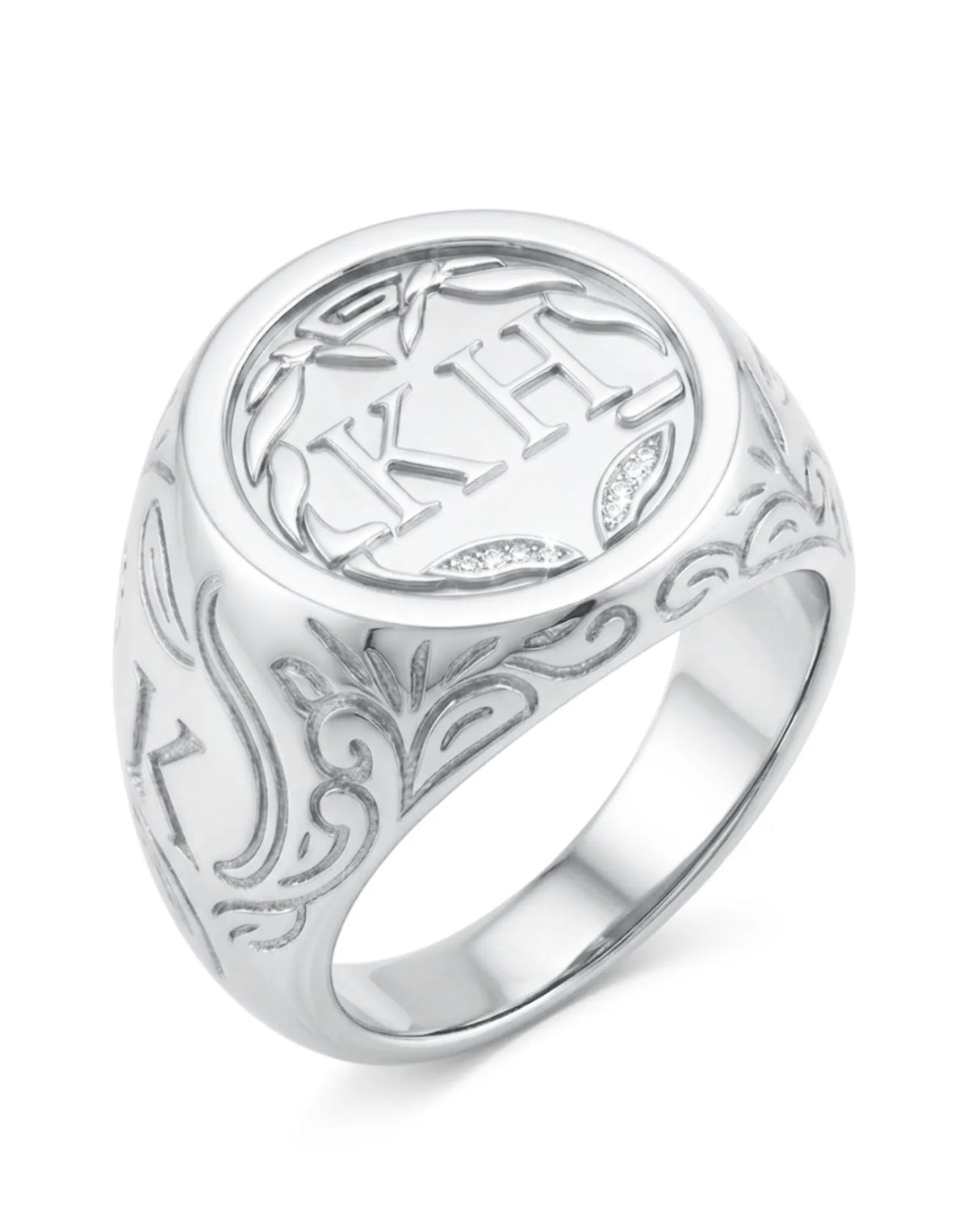 Silver ring with intricate designs and engraved text on a white background
