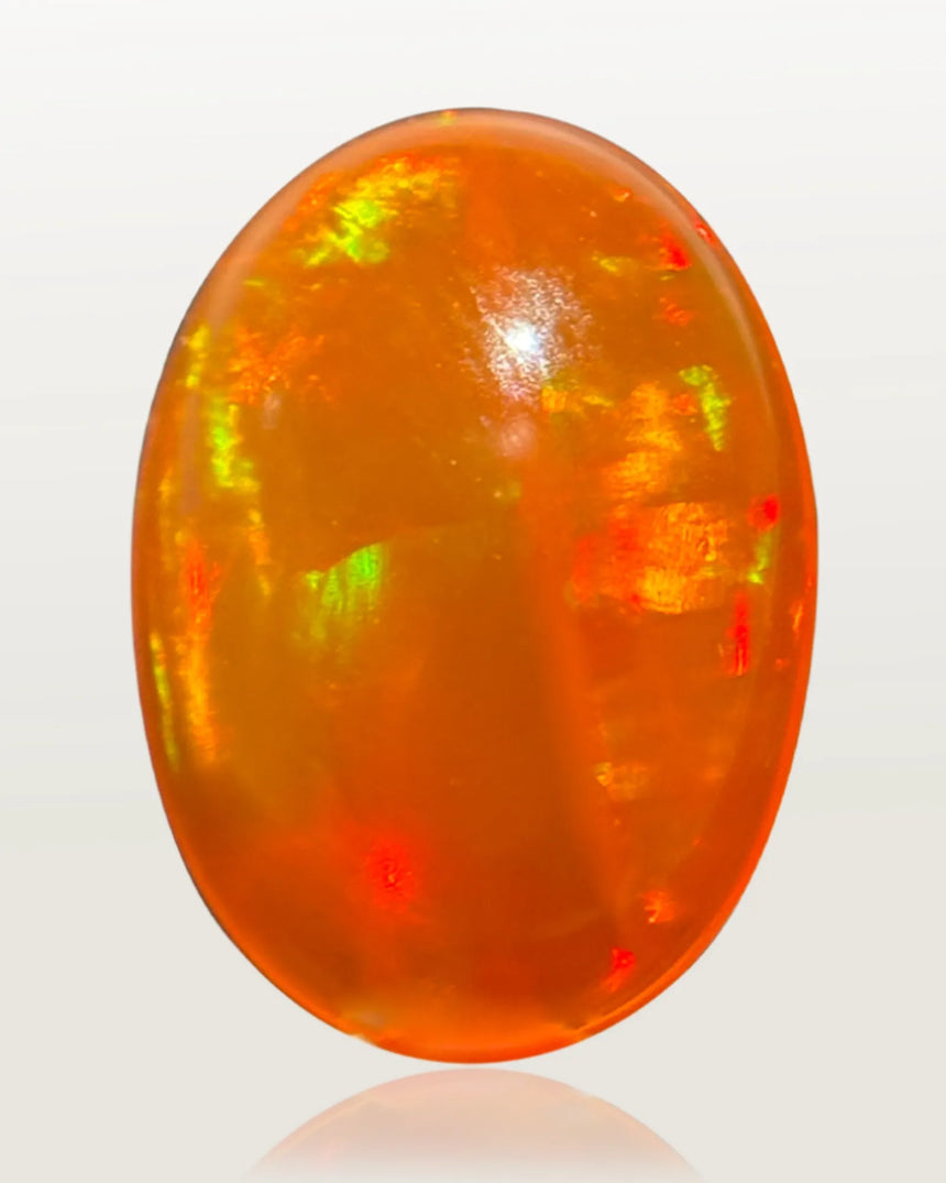 Mexican Fire Opal oval cabochon measuring 13.68 × 9.85 × 4.79 mm | SARATTI