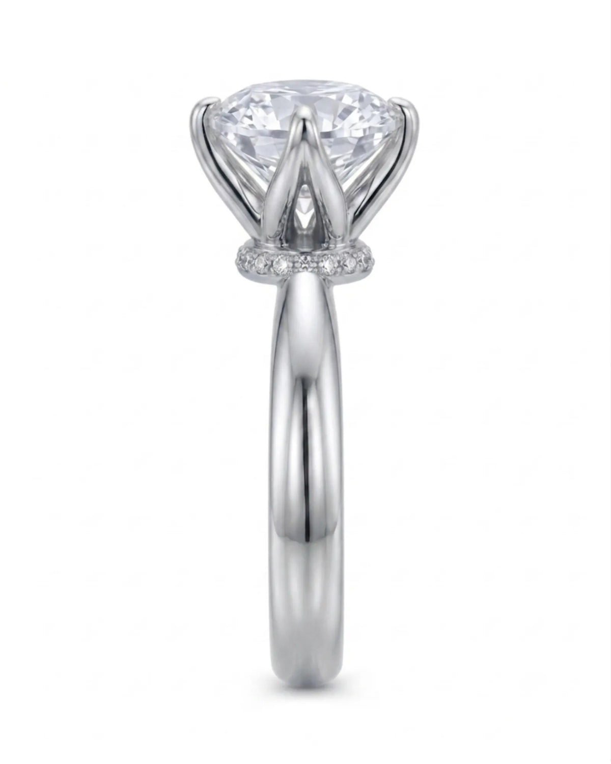 Minimal round moissanite ring with sculptural floral setting and polished platinum band | SARATTI