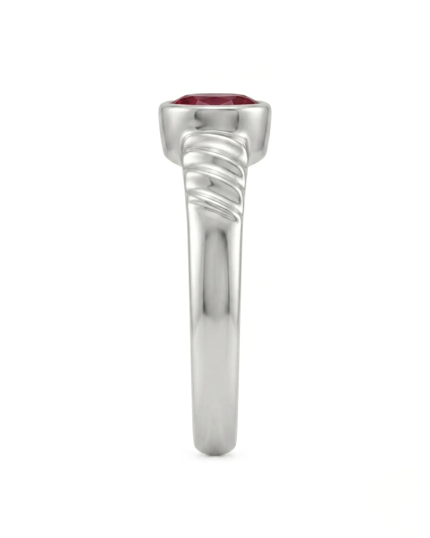 Modern platinum ruby ring with oval gemstone and triple wave shoulder detail | SARATTI
