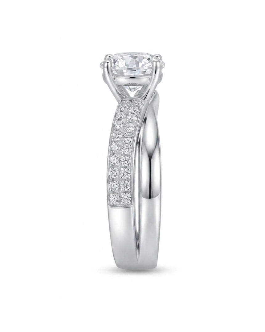 Modern round moissanite proposal ring with wide intertwined shoulders in polished 18K white gold | SARATTI
