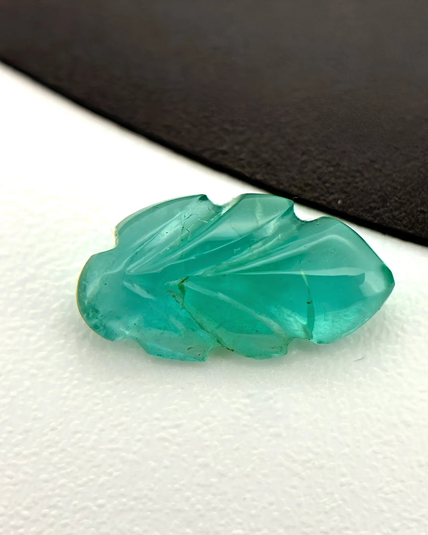 Natural Emerald carved leaf measuring 5 by 9.3 millimetres | SARATTI