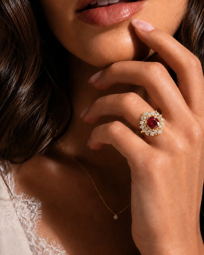 Natural cushion ruby ring with blooming diamond halo and pavé yellow gold setting | SARATTI