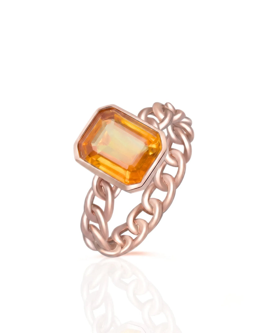 Natural orange sapphire ring with emerald cut center stone in 18K rose gold | SARATTI