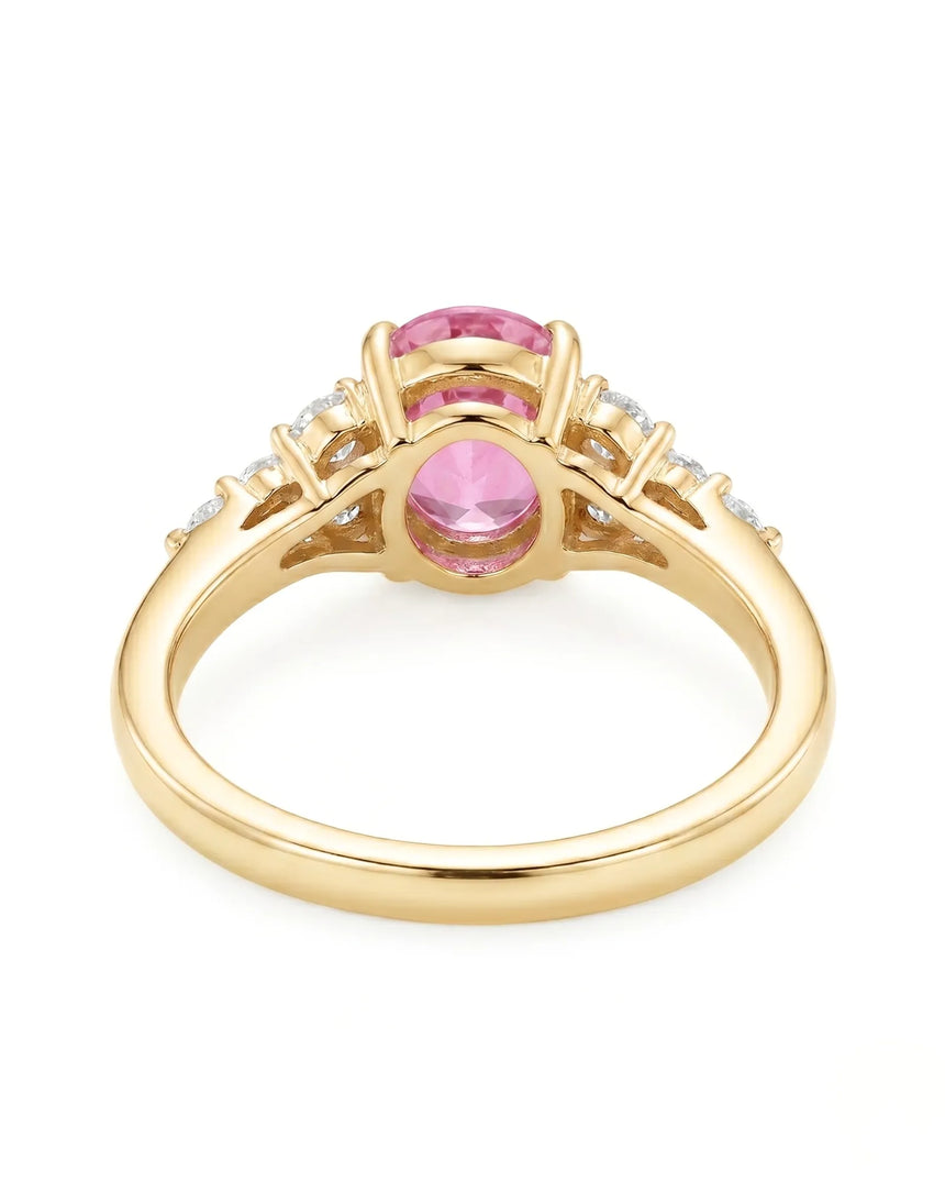 Natural oval pink sapphire ring with sparkling round diamonds in 18K yellow gold | SARATTI