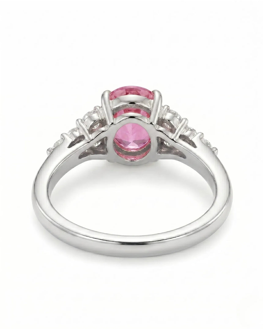 Natural oval pink sapphire ring with sparkling round diamonds in platinum | SARATTI