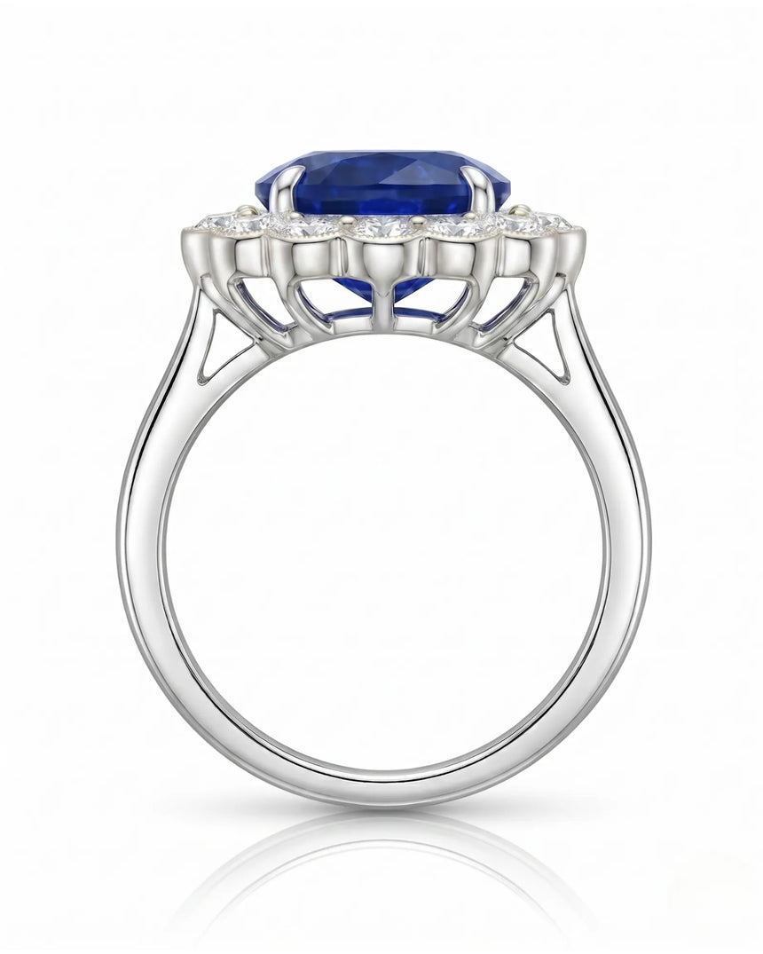 Natural oval sapphire ring framed by round brilliant diamonds in platinum | SARATTI