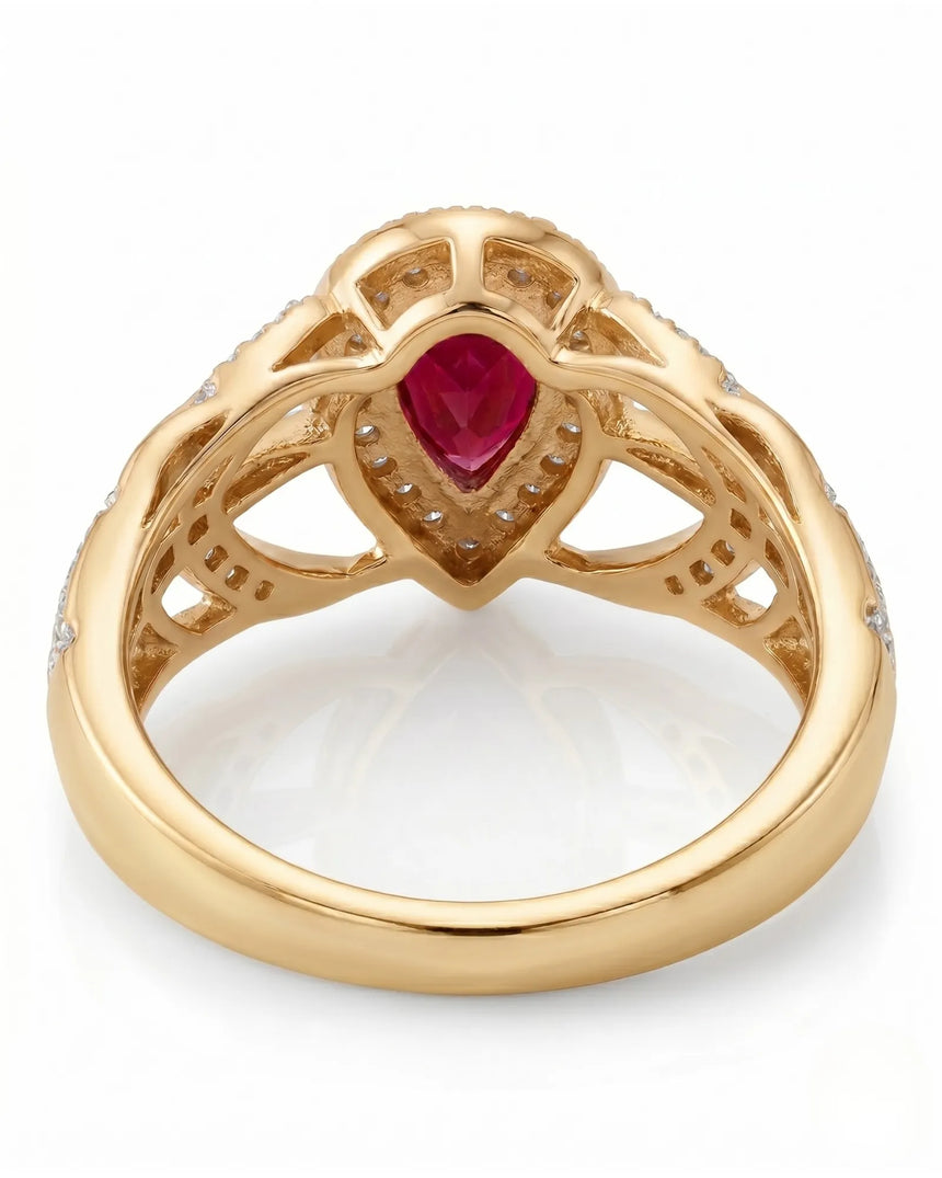 Natural pear ruby ring with bright diamond halo and warm yellow gold setting - SARATTI