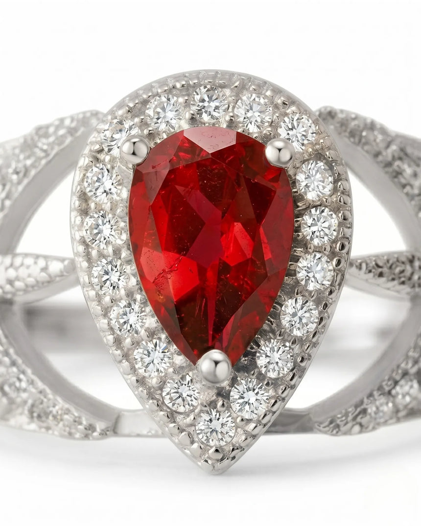 Natural pear ruby ring with bright diamond halo and white gold setting | SARATTI