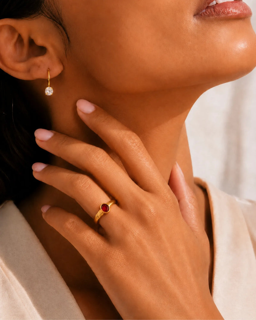 Natural red ruby ring with smooth oval bezel setting in 18K yellow gold | SARATTI