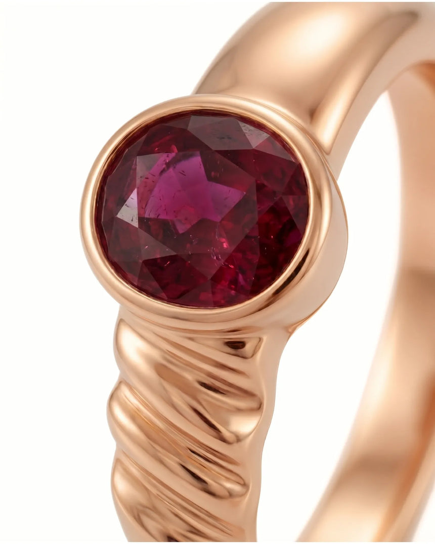Natural ruby ring highlighting oval red gemstone in polished 18K rose gold | SARATTI