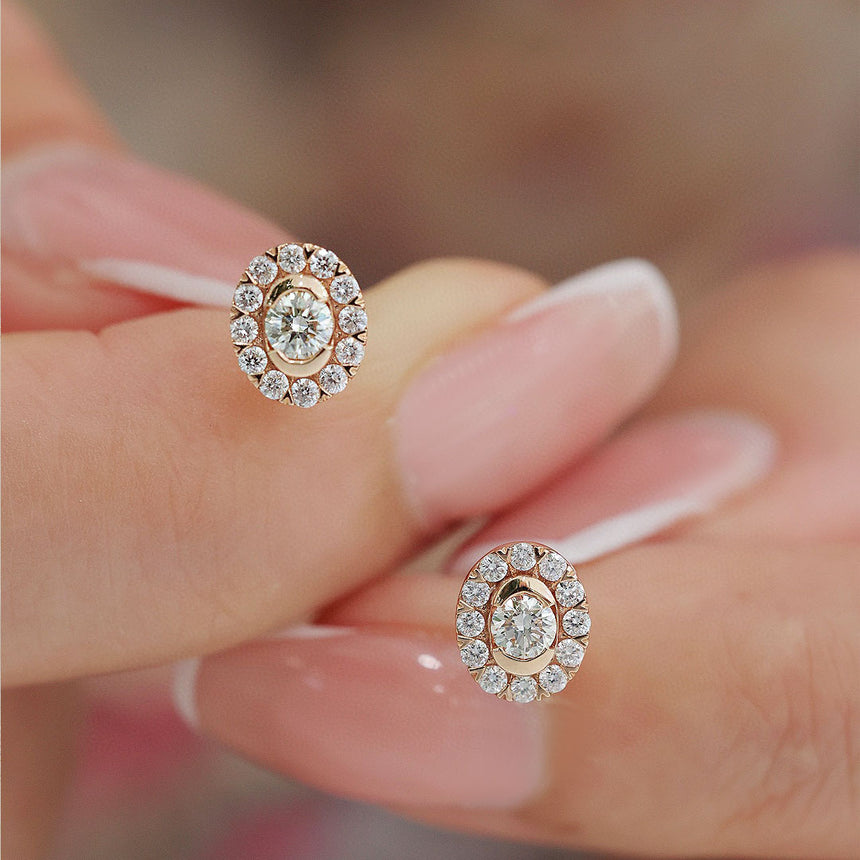 Minimalist Oval Diamond Earring with a Halo of Accents in Model's Fingers | Saratti | Custom High and Fine Jewelry
