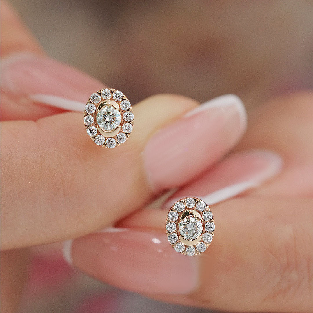 Minimalist Oval Diamond Earring with a Halo of Accents in Model's Fingers | Saratti | Custom High and Fine Jewelry 