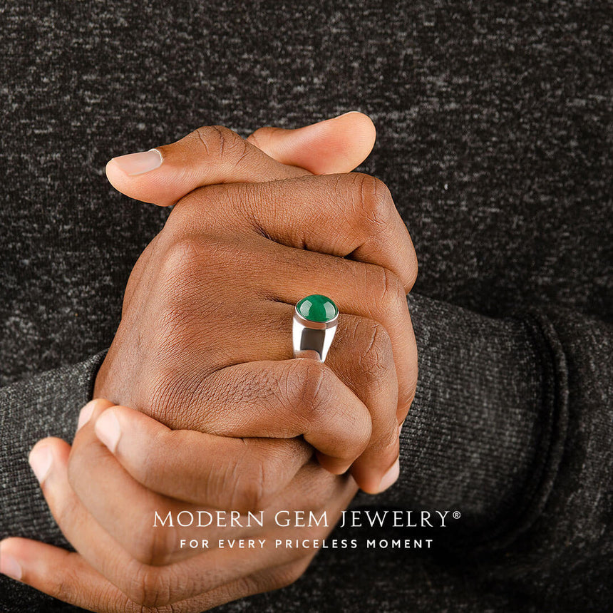 Mens emerald ring oval cabochon worn on model in platinum | SARATTI