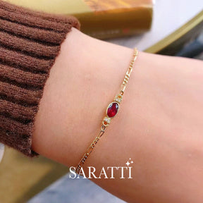 Model wears the Jupiter’s Rouge Ruby Bracelet | Saratti Fine Jewelry 