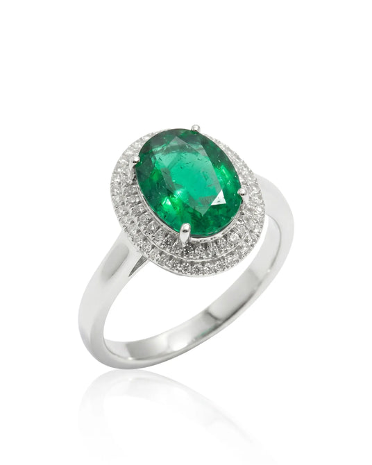 Oval Halo Eterna natural emerald and diamond ring in 18K white gold | SARATTI